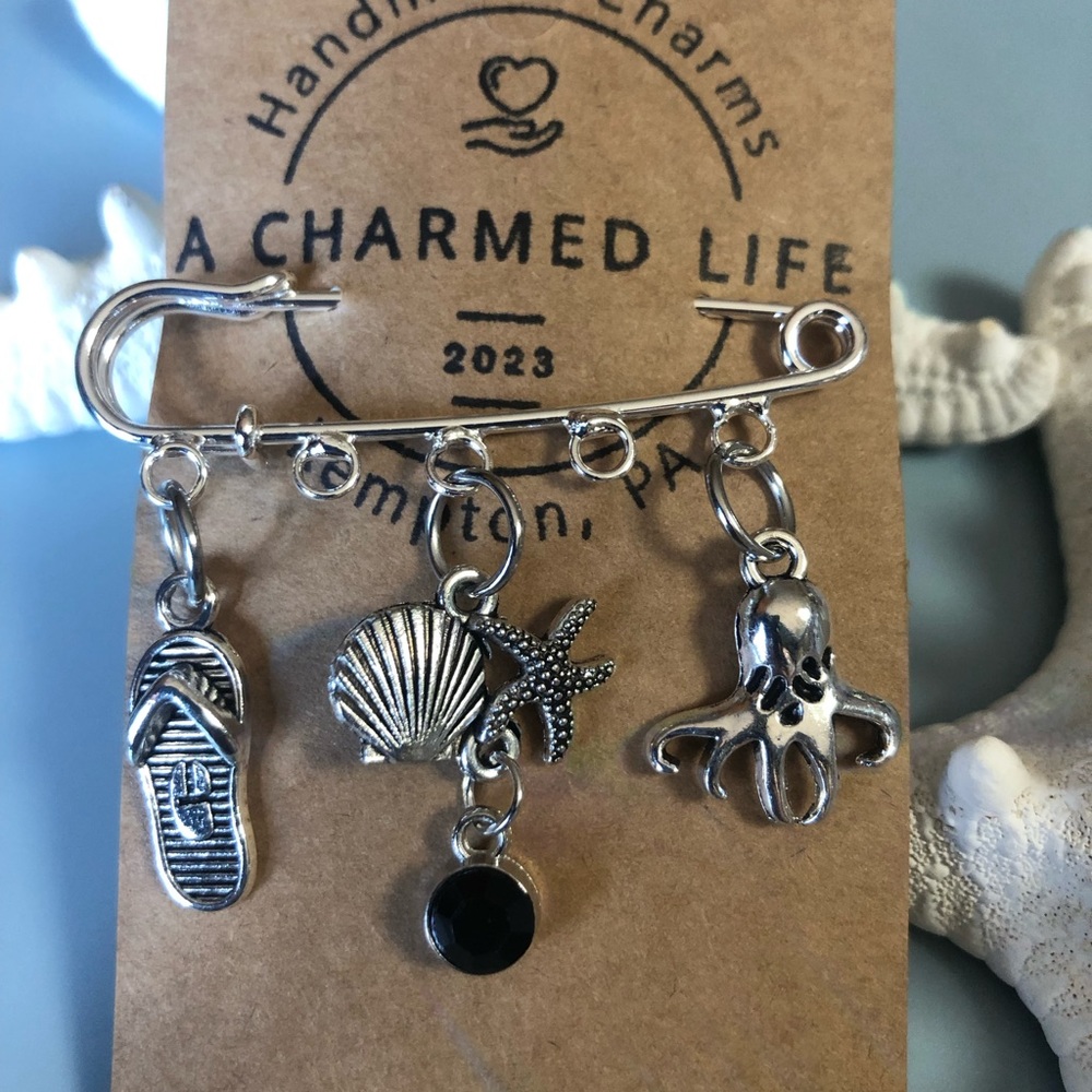NWT, Handmade by A Charmed Life. Silver Pin with Ocean Themed Silver charms